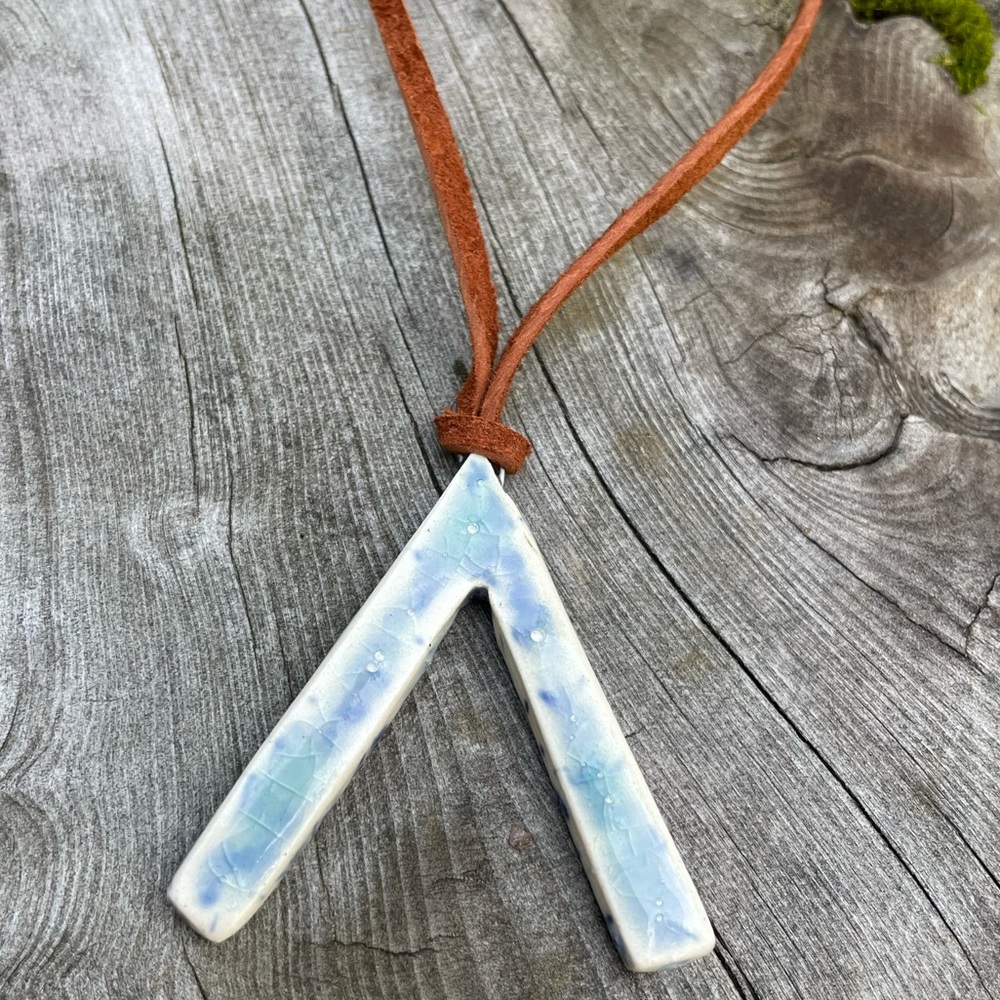 Handmade ceramic necklace on a suede chain
